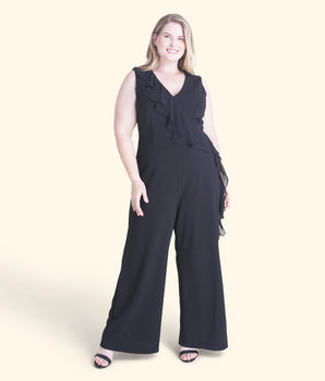 Woman posing wearing Black Sara Black Jumpsuit from Connected Apparel