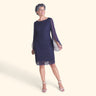 Woman posing wearing Navy Stevie Navy Sequin Lace Dress from Connected Apparel