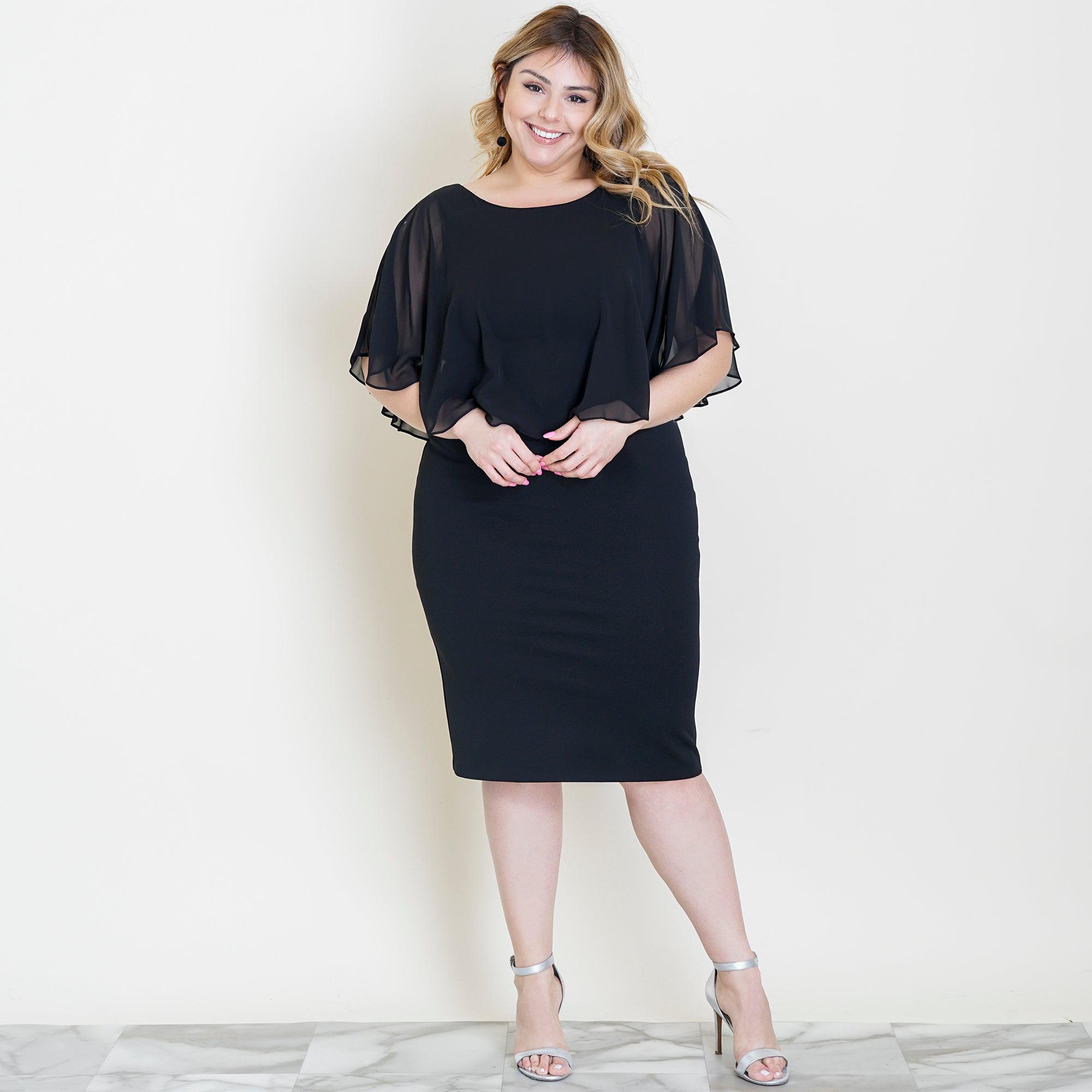 Woman posing wearing Black Elsa Black Midi Capelet Dress from Connected Apparel